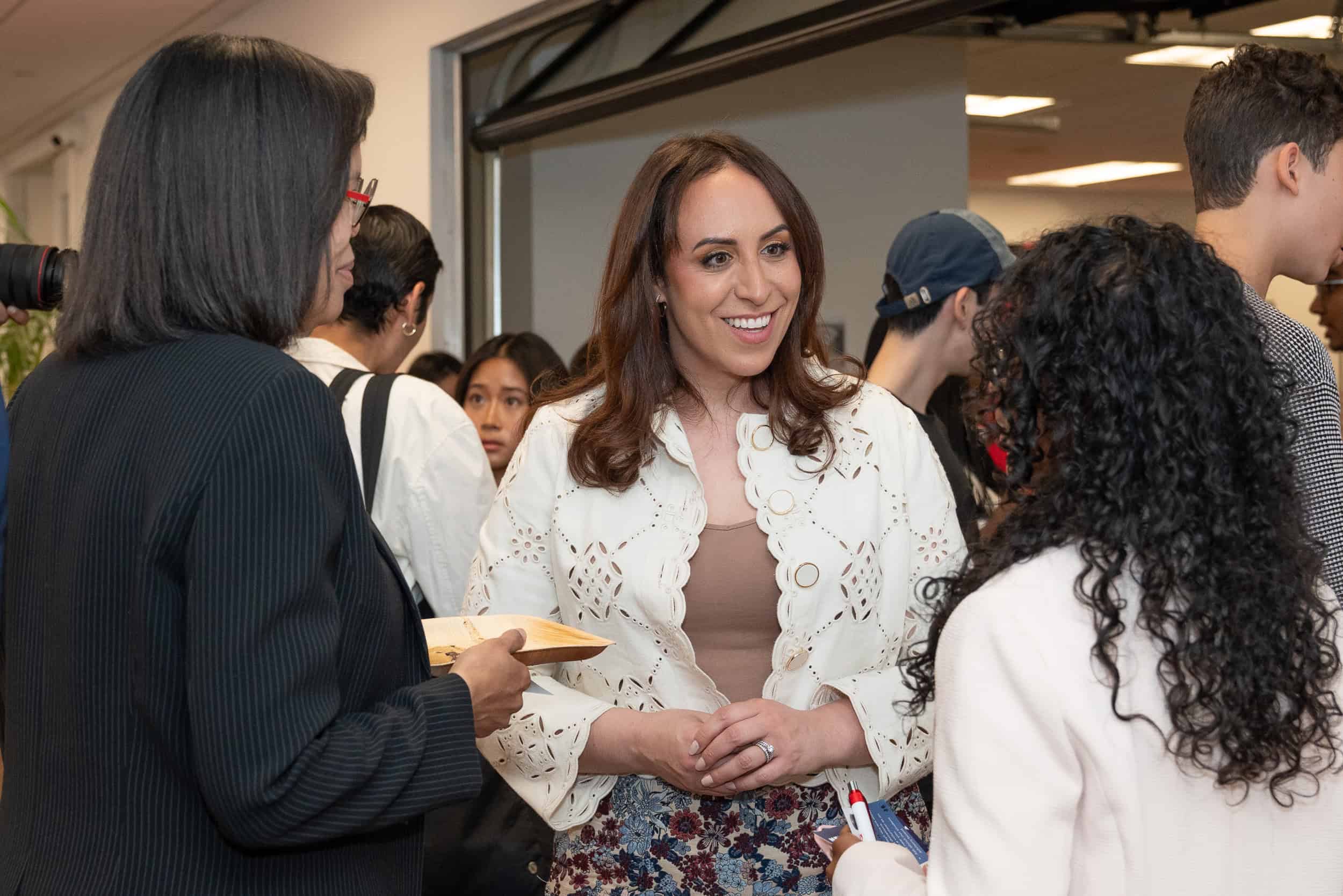Attendee networking and connecting at the forum