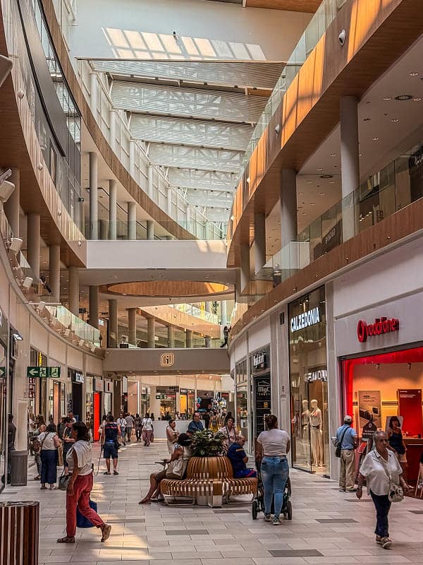 mall interior with people walking image
